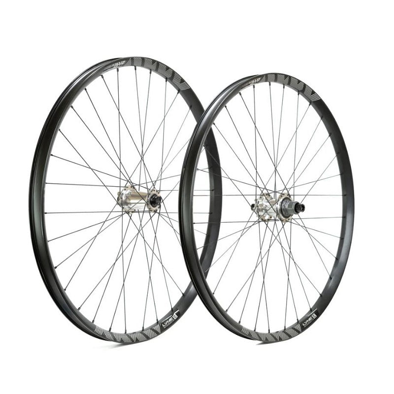 Two bicycle wheels on a white background